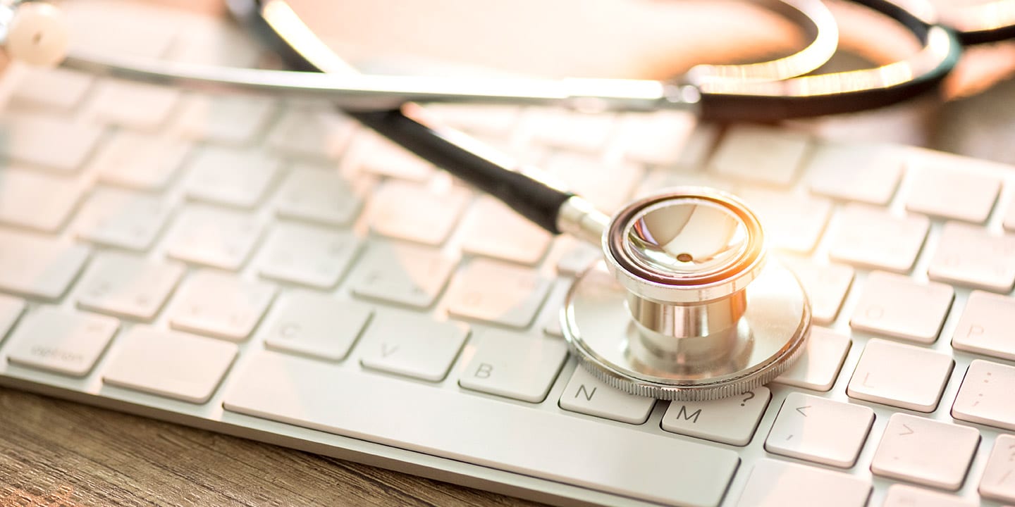 955256606 Stethoscope on keyboard