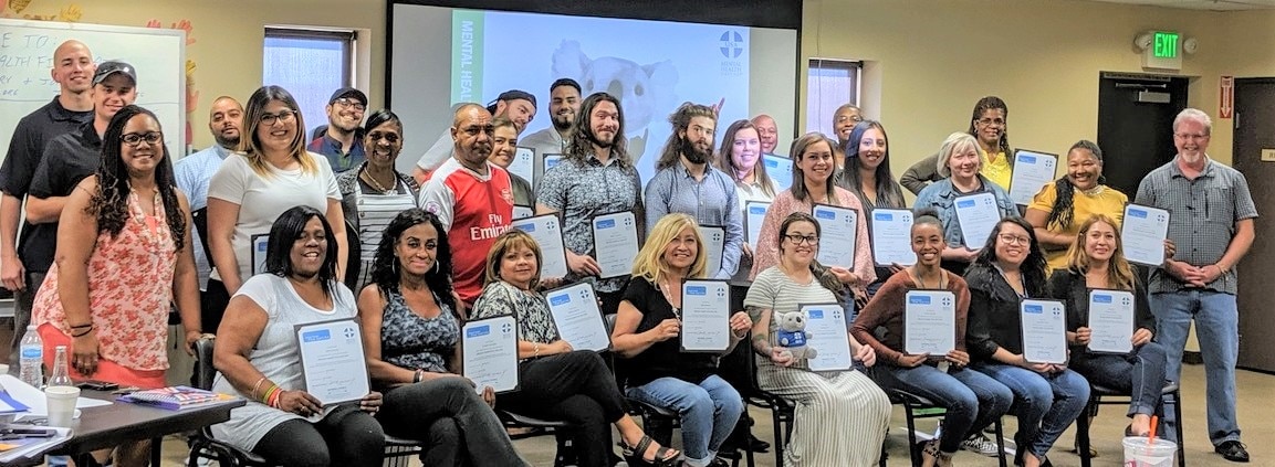 Mental Health First Aid students with their certificates