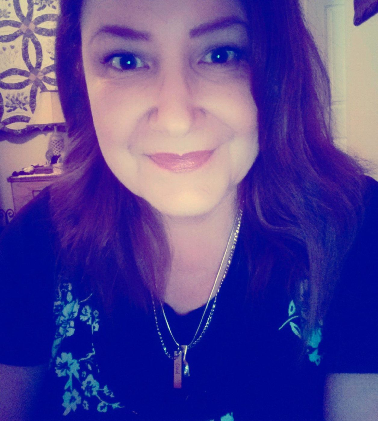 Smiling woman in dark shirt