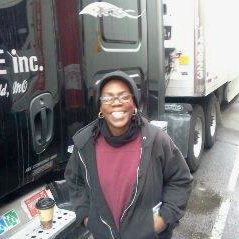Dee2 smiling woman in front of a truck