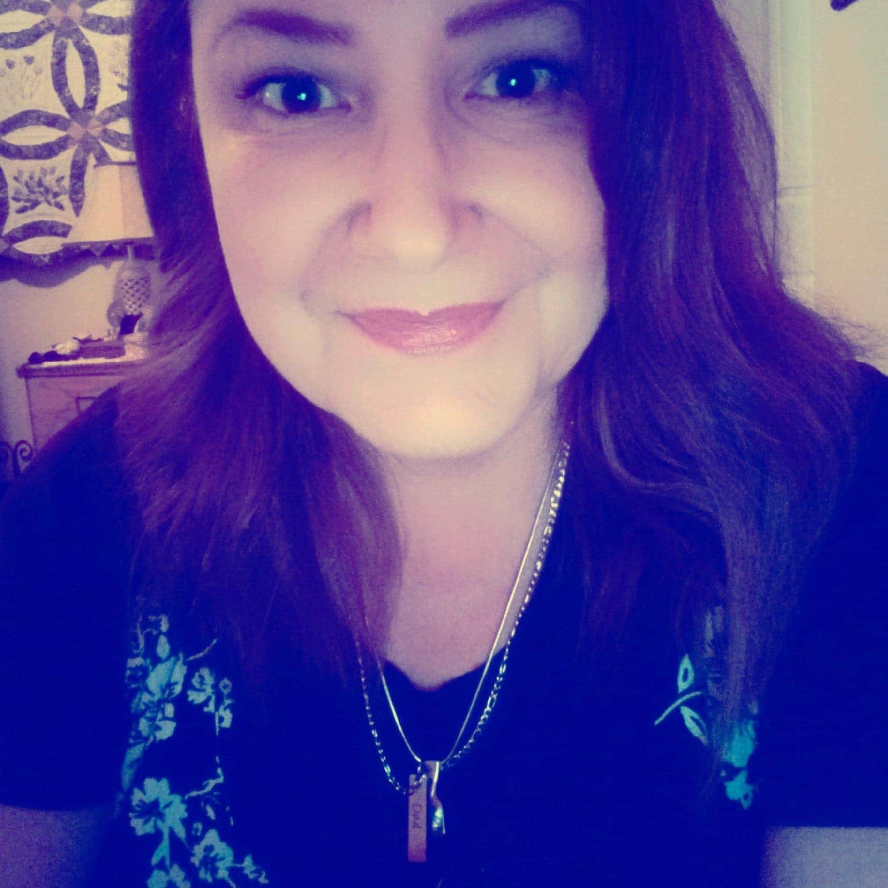 Smiling woman in dark shirt